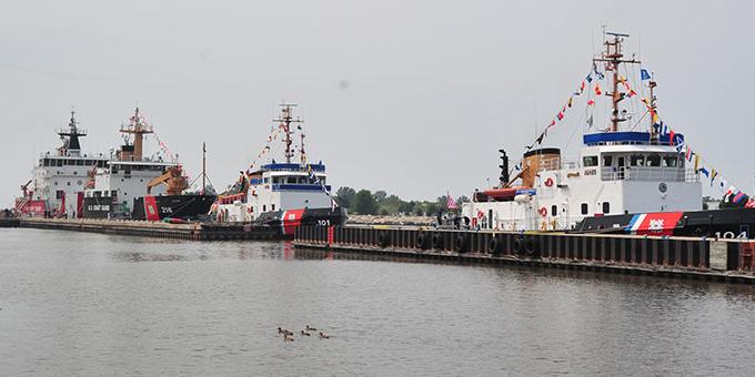 U.S. Coast Guard boats lined up in the water.