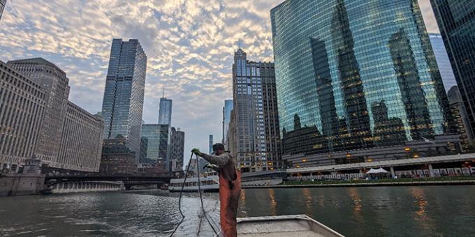 An Illinois Department of Natural Resources-contracted fishing crew sets gill nets in the Chicago River to sample for invasive carp