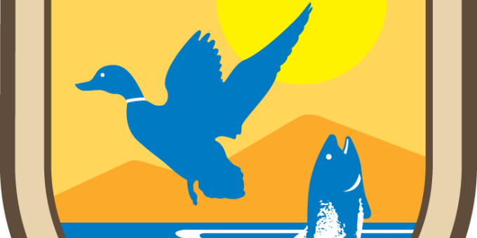 Official emblem of the U.S. Fish and Wildlife Service showing a duck taking flight and a fish jumping out of the water with the sun rising over a mountain. 