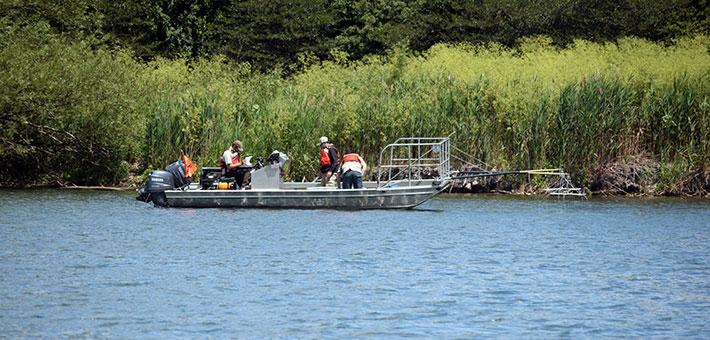 A field team at work on a boat.